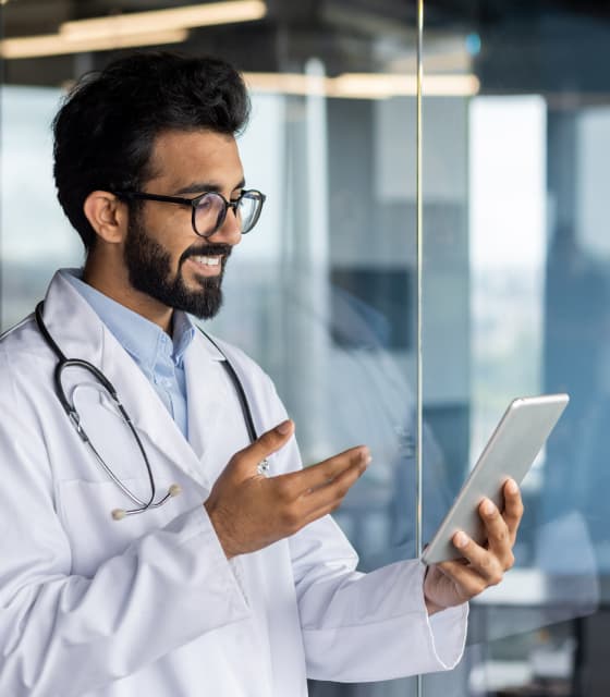 A UAE doctor reviewing an employee health plan