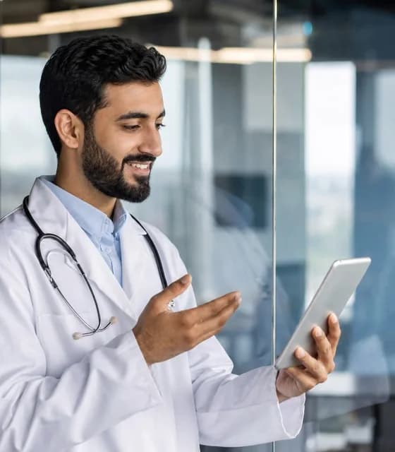 A UAE doctor reviewing an employee health plan